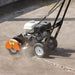 orange Brave Crack Cleaner being used on a concrete surface