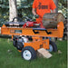 Orange bravepro 30 ton log splitter with a person in an orange shirt labeled 'Brave' in a forest setting.
