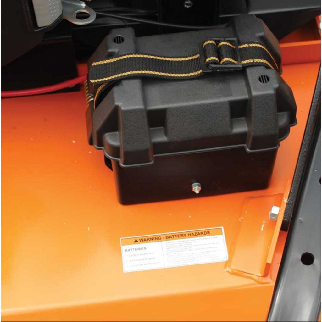 Black battery pack with straps on a bravepro rough cut tow behind mower.