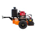 Orange and black Brave tow behind leaf blower with a red engine on a white background