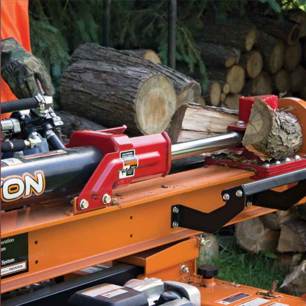bravepro 24 ton log splitter tow behind with logs in a forest setting