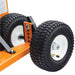 Close-up of two large wheels of a brave pro 7 trencher with orange metal frame on a white background