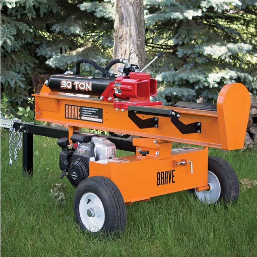 Orange brave log splitter 30 ton labeled 'BRAVE' on a grassy area with trees in the background