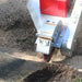 dosko 20 hp self propelled stump grinderStump grinder in action, cutting a stump with visible brand.