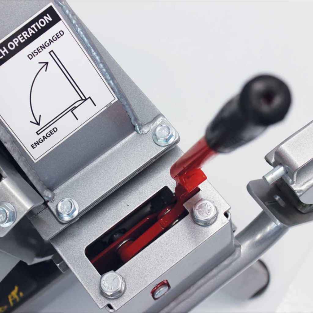 Close-up of a dosko 4 inch brush chipper with a red lever and warning label on a white background