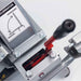 Close-up of a dosko 4 inch brush chipper with a red lever and warning label on a white background