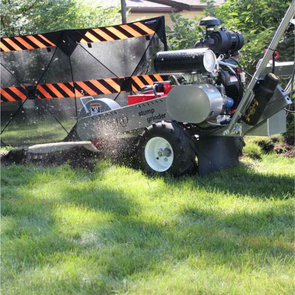 dosko 20 hp self propelled Stump grinder in operation on a grassy area with trees in the background