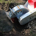 dosko 20 hp self propelled stump grinder in use on a tree stump with visible brand name.