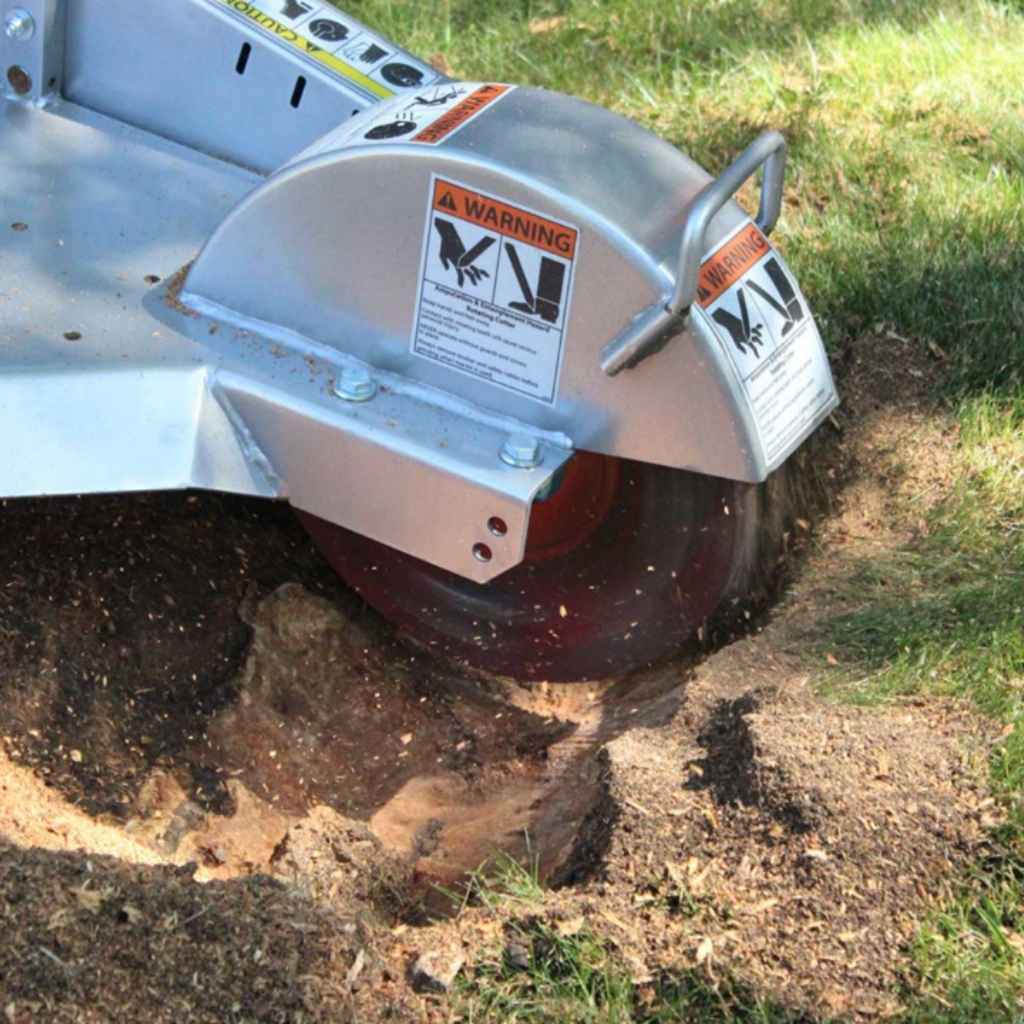 dosko 13-hp Stump grinder removing a tree stump from the ground