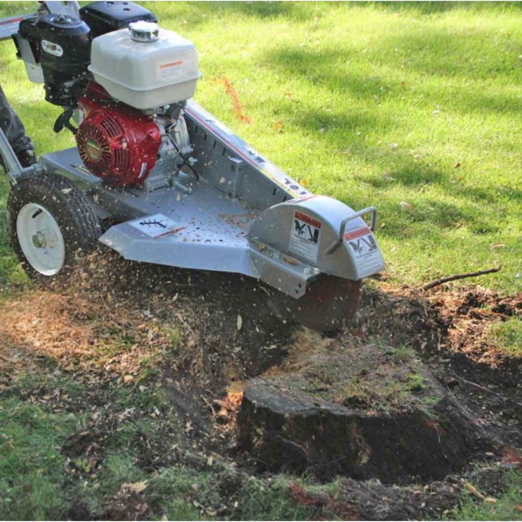 dosko walk behind Stump grinder 13 hp removing a stump in a grassy area