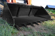 Large black metal Greg loflin bucket  attachment on a construction vehicle in an outdoor setting.