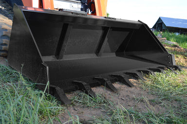Large black metal Greg loflin bucket  attachment on a construction vehicle in an outdoor setting.