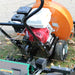 Close-up of a jrco blower buggy mower mount holding a towable leaf blower on grass