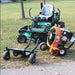 Mower with jrco blower buggy mower attachment and Leaf Blower on a grassy area