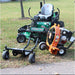 Mower with a jrco blower buggy 601 mower attachment and a Leaf Blower on a grassy area