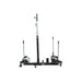 Black metal k&m Manufacturing wheel dolly for sale on a white background
