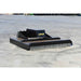 A black Loflin closed front brush cutter attachment with a digital display screen, photographed on a concrete surface.