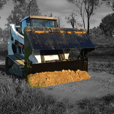 Skid steer loader with a loflin fabrication 4 in 1 combo bucket attached full load of dirt in an outdoor setting
