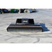 A black Loflin closed front brush cutter with multiple chains hanging down the front, positioned on a concrete surface.