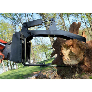 Black loflin fork grapple on a power tool with a background of trees and a clear sky.