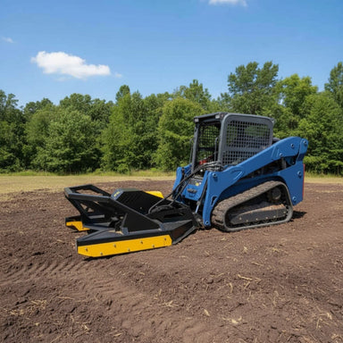 Blue compact track loader with a loflin severe duty brush cutter on a dirt field with trees in the background