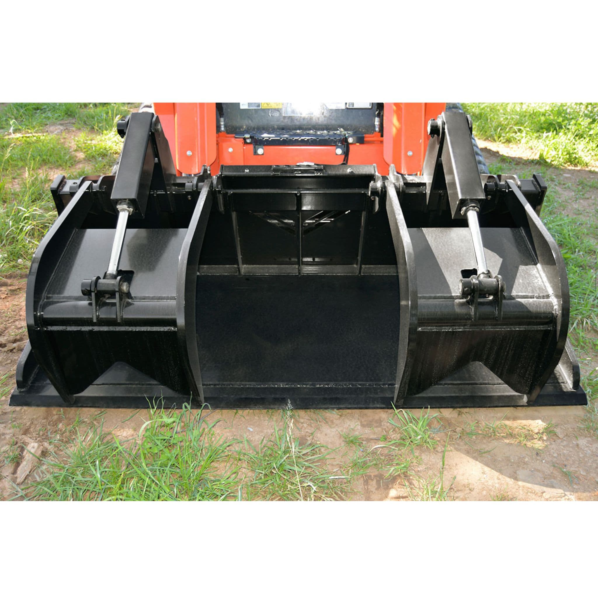 Loflin HD grapple bucket on a vehicle with grass in the background
