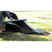 Black loflin mini stump bucket on a vehicle in a grassy field