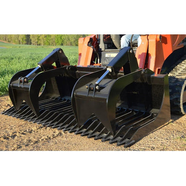 Black loflin skid steer rock grapple on a construction vehicle with a field background