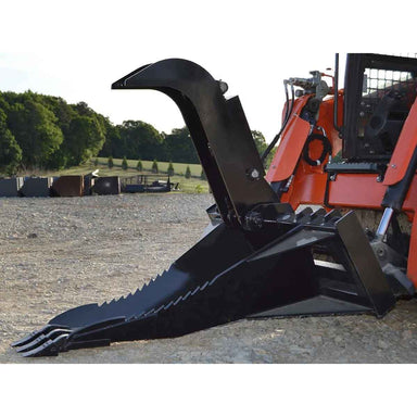 Black Loflin stump bucket attached to a red and black excavator in an outdoor setting with trees in the background.