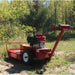 Red maxim brush cutter 26 inch in a wooded area