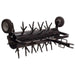 Black maxim 48 inch tow behind plug aerator with wheels on a white background