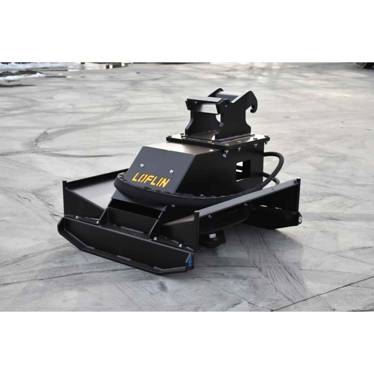 A black heavy-duty loflin fabrication mini excavator brush cutter attachment with a yellow 'LOFLIN' logo, photographed on a gray concrete surface.