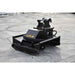 A black heavy-duty loflin fabrication mini excavator brush cutter attachment with a yellow 'LOFLIN' logo, photographed on a gray concrete surface.