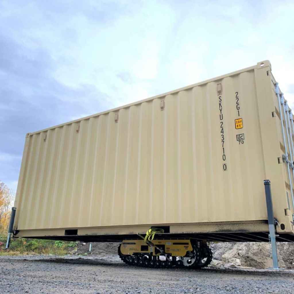 movex xc 30 all terrain carrier carrying a shipping container on a gravel ground