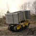 movex cross country vehicle xc 30 carrying a stack of metal pipes on a dirt path with trees in the background