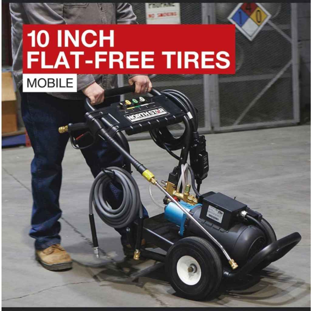Person using a Northstar 230v 3000 psi pressure washer with text about 10-inch flat-free tires.