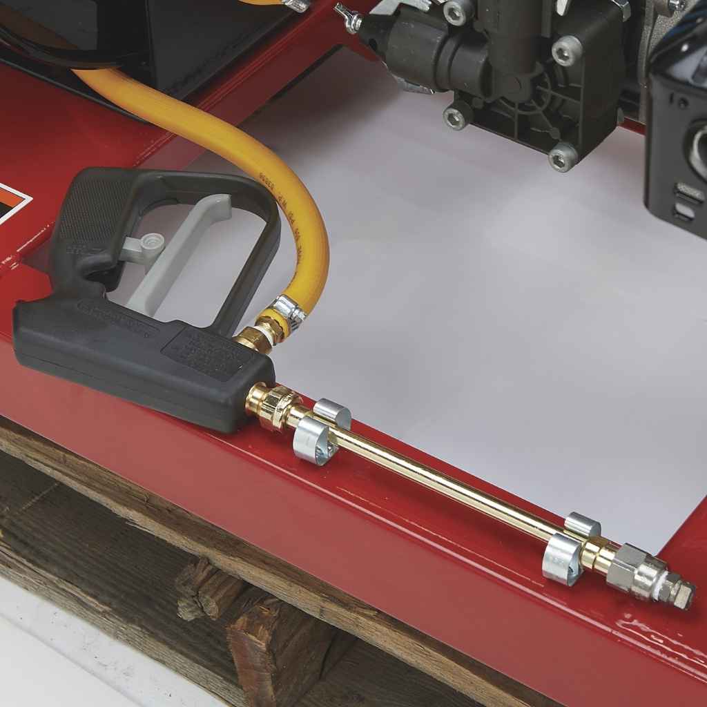 Northstar skid sprayer 55 gallon spray nozzle and hose on a red surface