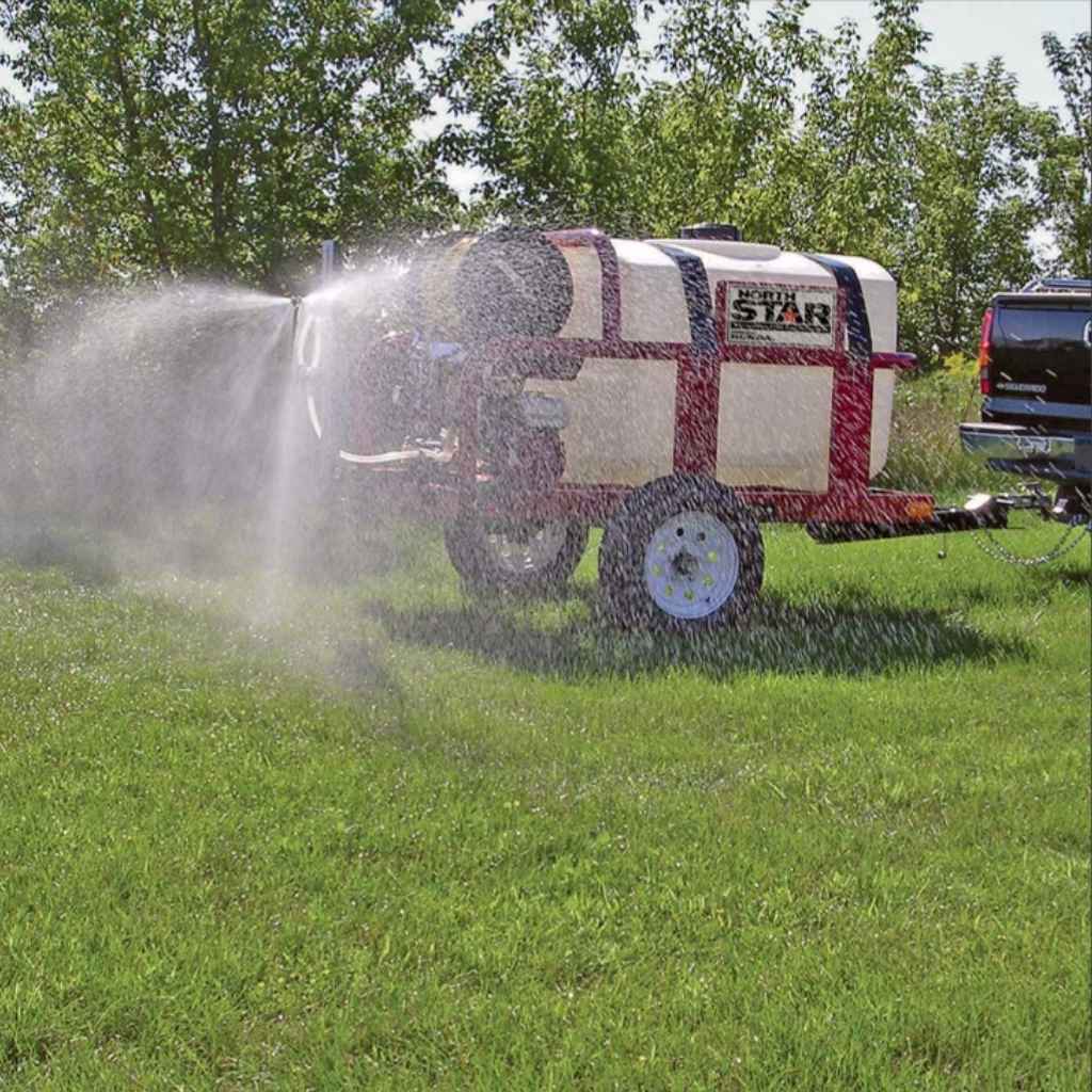 Northstar 200 gallon skid sprayer  labeled 'Star' spraying water on grass
