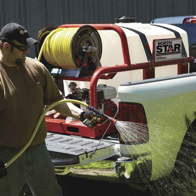 Person using a Northstar skid sprayer 200 gallon capacity attached to a truck with a North Star Equipment logo.