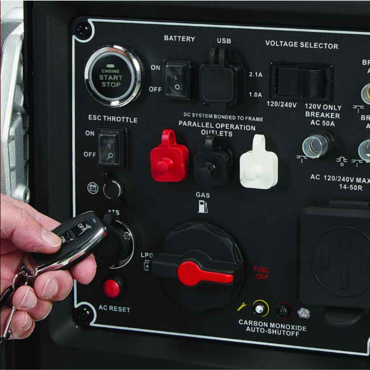 Control panel of a powerhorse 10500 inverter generator with buttons and labels, including a hand holding a key fob.