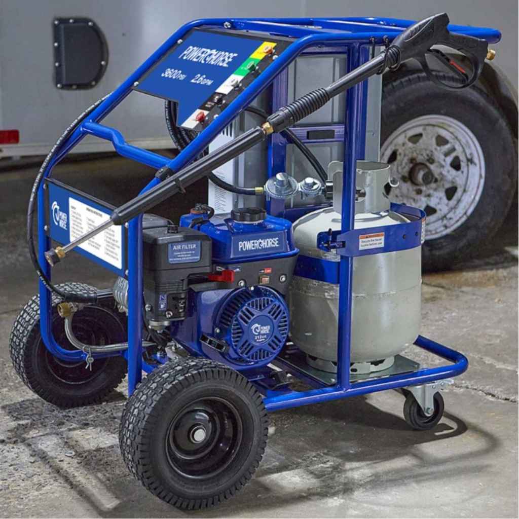 Blue powerhorse hot water 3600 psi pressure washer on wheels with visible branding in an industrial setting