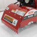 Red maxim rear tine tiller with warning labels on a white background