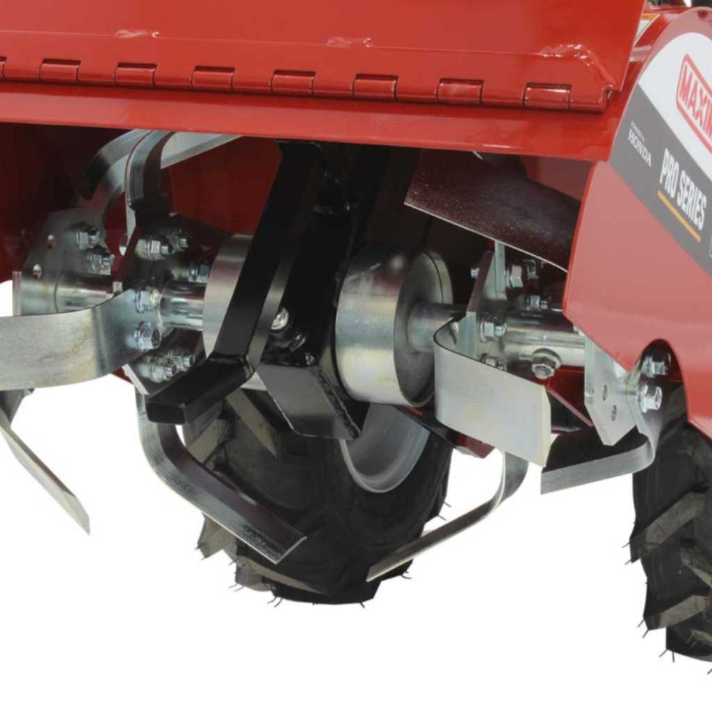 Close-up of a red maxim rt190h tiller with metal blades and wheels on a white background