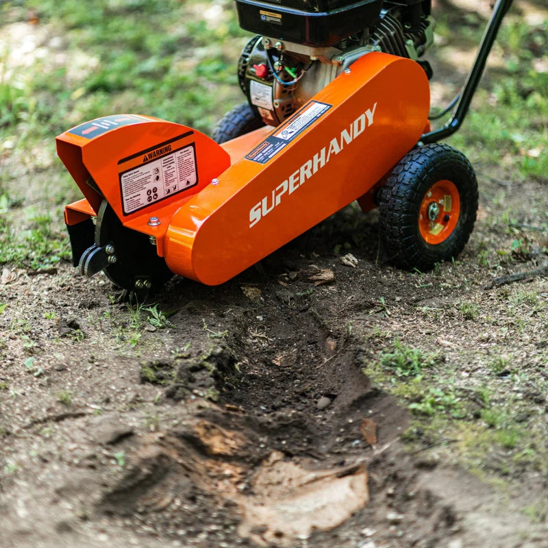 An orange and black SuperHandy compact stump grinder with a 9HP engine and a 12-inch cutting blade. Front view outdoors.