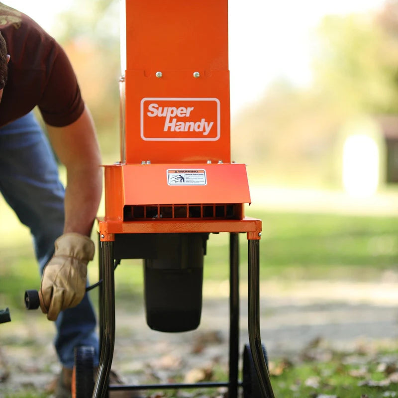 An orange electric leaf mulcher with black steel housing and wheels, branded by SuperHandy. Front view outdoors.