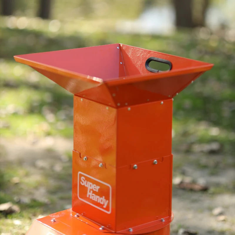 Orange superhandy electric leaf shredder with 'Super Handy' branding on a blurred natural background