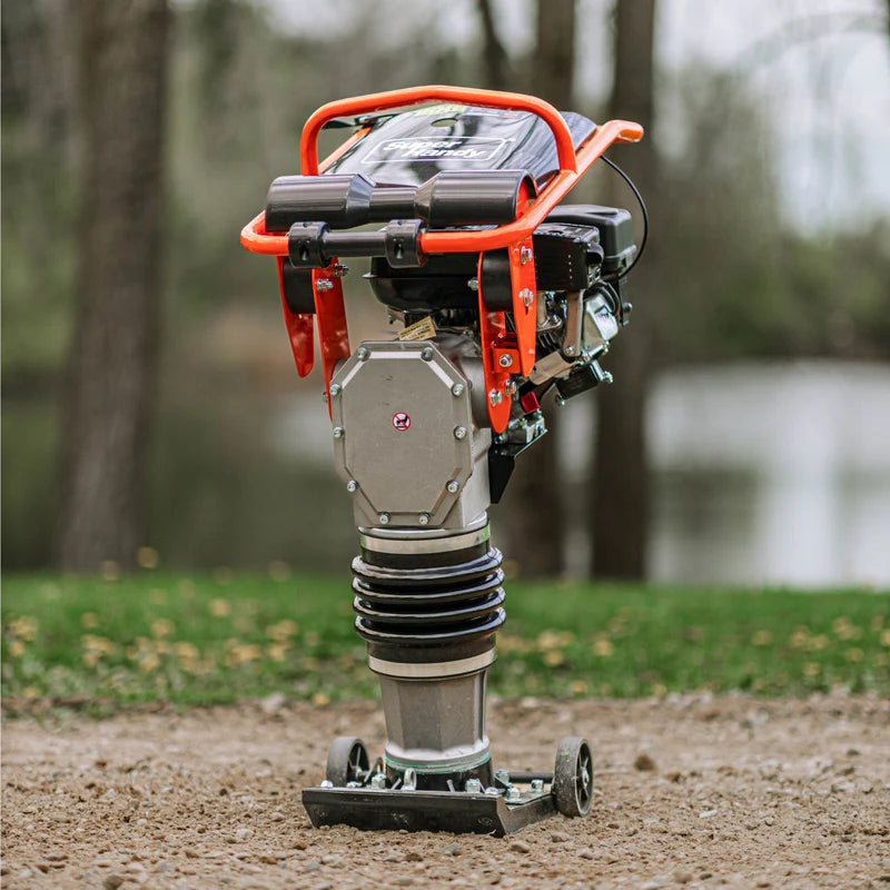 A jumping jack tamping rammer with a 7HP 209CC engine, predominantly black and orange in color, designed for soil compaction. Front view outdoors.