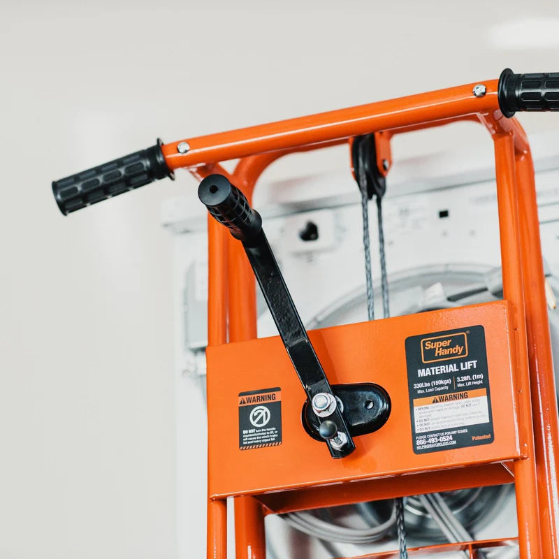 An orange material lift stacker and pallet dolly with a hand crank and swivel caster wheels. Handle view.