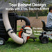 Tow behind design for ATVs and tractors with a person sitting on a trailer.