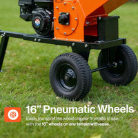 Wood chipper with 16-inch pneumatic wheels on grass